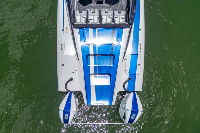  Yacht Photos Pics Top view of 2023 Performance Powerboats P360 with dual engines on green water.