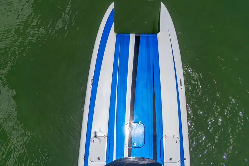  Yacht Photos Pics 2023 Performance Powerboats P360, aerial view, blue and white design on green water.