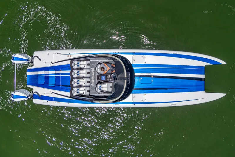  Yacht Photos Pics 2023 Performance Powerboats P360, aerial view, sleek design, blue and white, on green water.