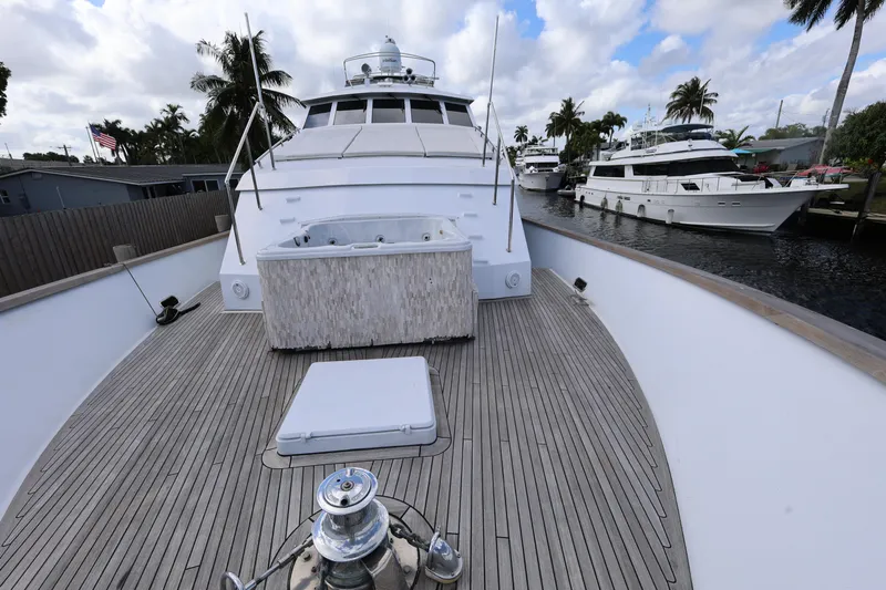 Ocean Drive Yacht Photos Pics 1988 Broward 124 Tri-Deck MY yacht docked, showcasing spacious deck and sleek design.
