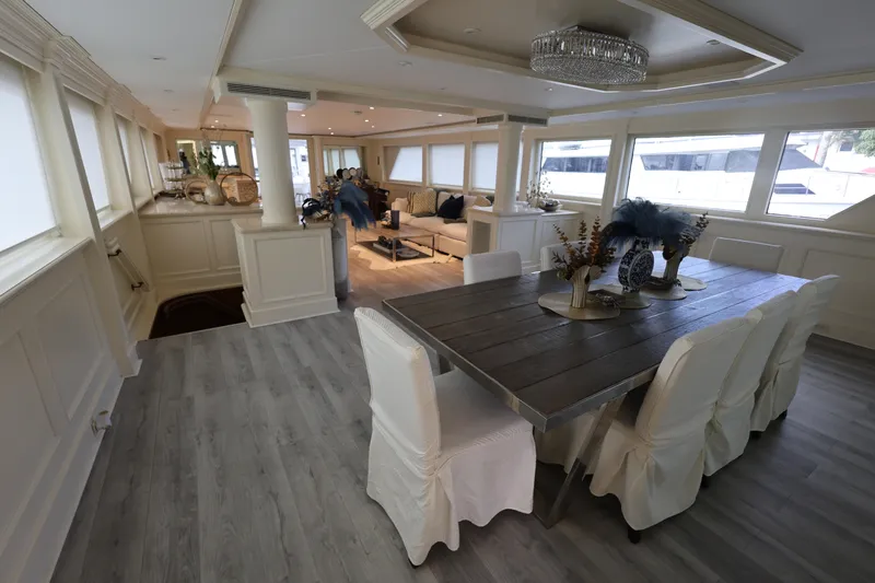 Ocean Drive Yacht Photos Pics Luxurious interior of 1988 Broward 124 Tri-Deck MY yacht with elegant dining area.