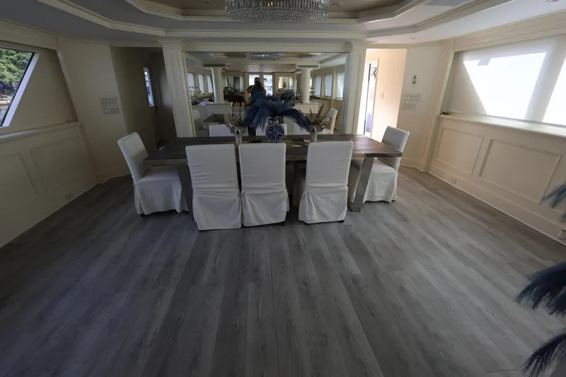 Ocean Drive Yacht Photos Pics Luxurious dining area on 1988 Broward 124 Tri-Deck MY yacht with elegant decor.