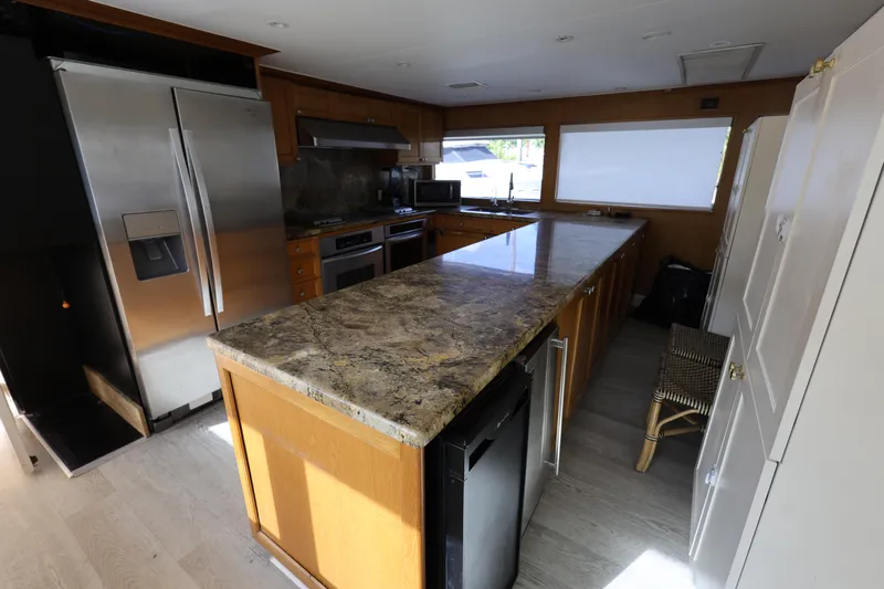 Ocean Drive Yacht Photos Pics Luxurious kitchen interior on 1988 Broward 124 Tri-Deck MY yacht with modern appliances.