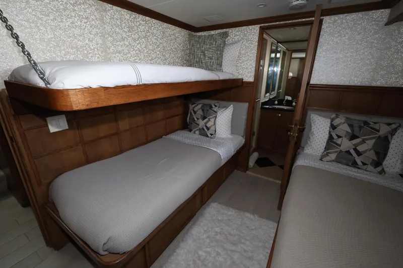 Ocean Drive Yacht Photos Pics Luxurious cabin interior of 1988 Broward 124 Tri-Deck MY yacht with bunk beds.