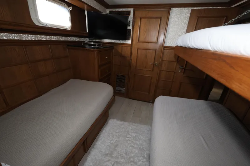 Ocean Drive Yacht Photos Pics Luxurious cabin interior of 1988 Broward 124 Tri-Deck MY yacht with wooden furnishings.