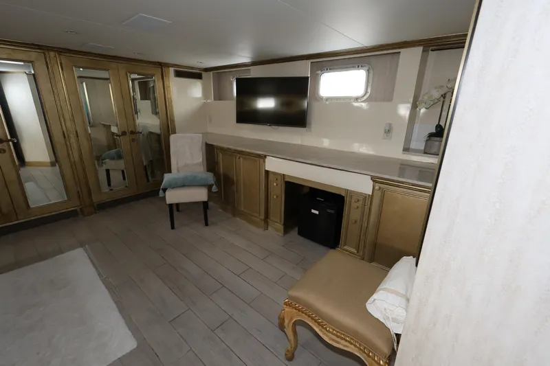 Ocean Drive Yacht Photos Pics Luxurious interior of 1988 Broward 124 Tri-Deck MY yacht with elegant furnishings.