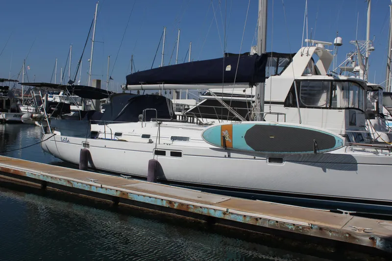 Hawaiian Passage Yacht Photos Pics 1997 Beneteau Oceanis 461 yacht docked with paddleboard on deck.