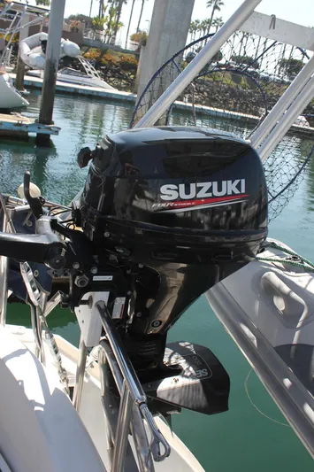 Hawaiian Passage Yacht Photos Pics Suzuki outboard motor on a 1997 Beneteau Oceanis 461 sailboat in a marina.