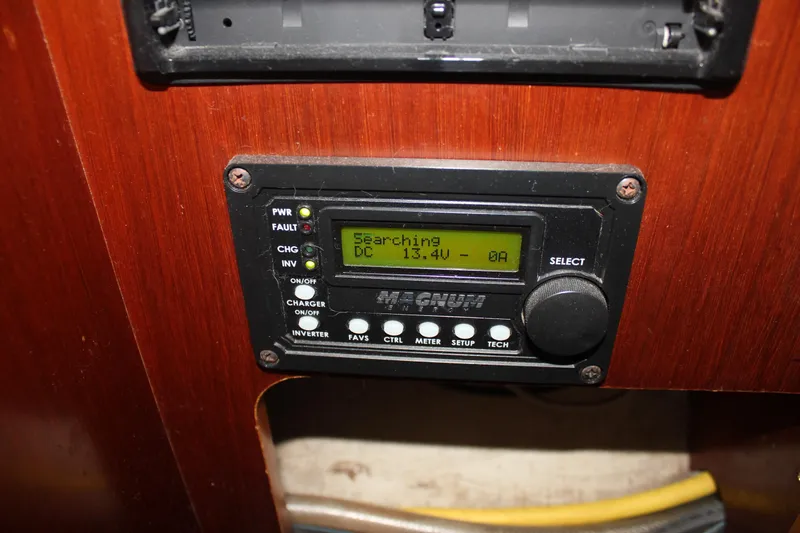 Hawaiian Passage Yacht Photos Pics Control panel on 1997 Beneteau Oceanis 461 sailboat, displaying "Searching" and voltage reading.