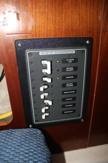 Hawaiian Passage Yacht Photos Pics Electrical panel on a 1997 Beneteau Oceanis 461 sailboat, featuring various switches and indicators.