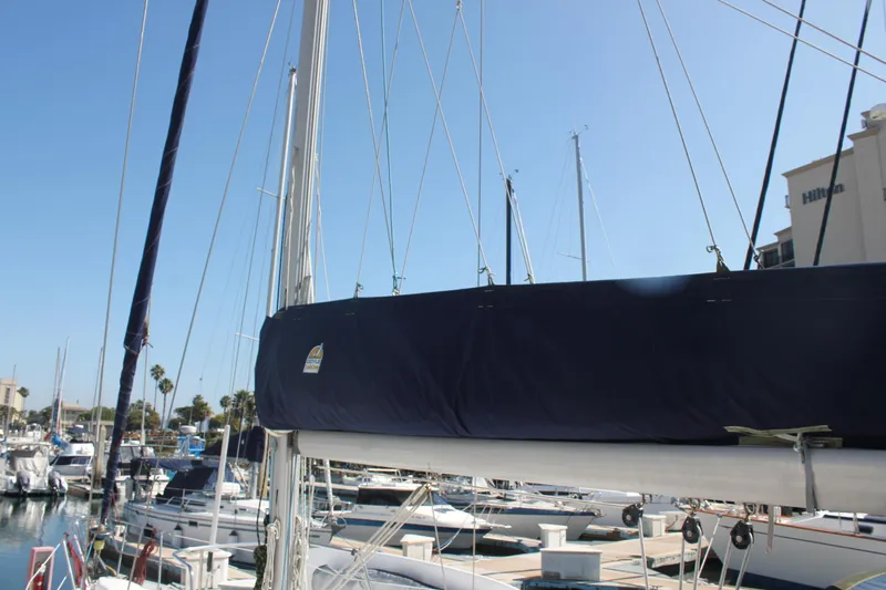 Hawaiian Passage Yacht Photos Pics 1997 Beneteau Oceanis 461 sailboat docked in a marina under clear blue skies.