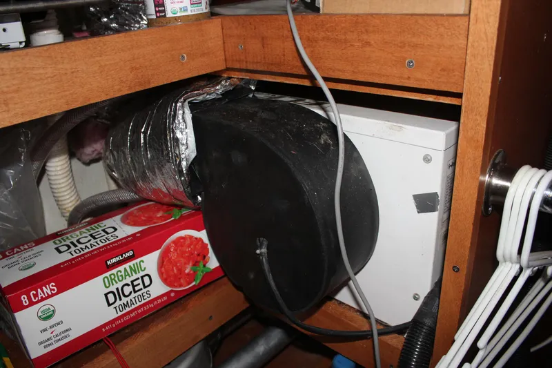 Hawaiian Passage Yacht Photos Pics Storage area in a 1997 Beneteau Oceanis 461 with ductwork and canned tomatoes.