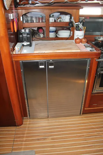 Hawaiian Passage Yacht Photos Pics Galley kitchen in 1997 Beneteau Oceanis 461 yacht with stainless steel cabinets.
