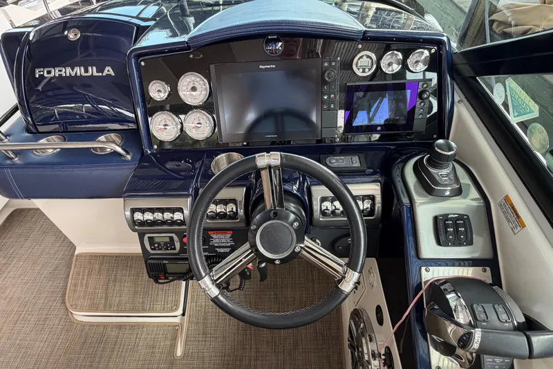  Yacht Photos Pics 2017 Formula 350 Crossover Bowrider dashboard with steering wheel, gauges, and navigation controls.