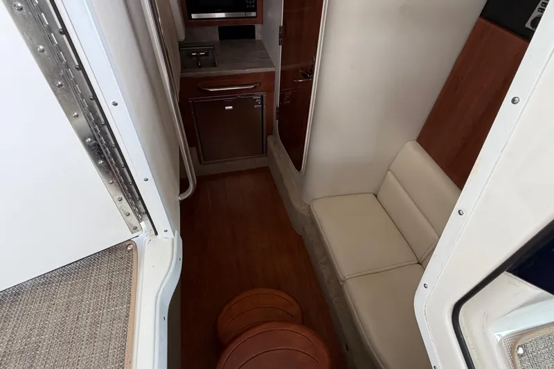  Yacht Photos Pics 2017 Formula 350 Crossover Bowrider interior with seating and kitchenette.