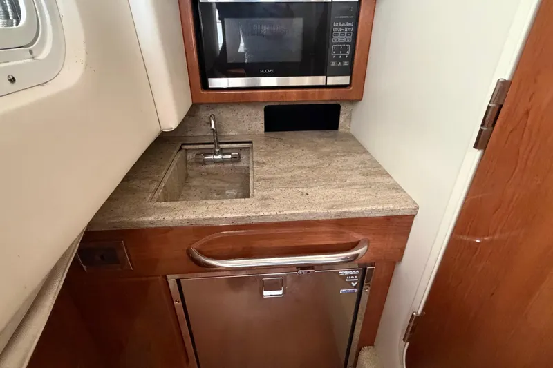  Yacht Photos Pics 2017 Formula 350 Crossover Bowrider kitchenette with sink, microwave, and mini-fridge.