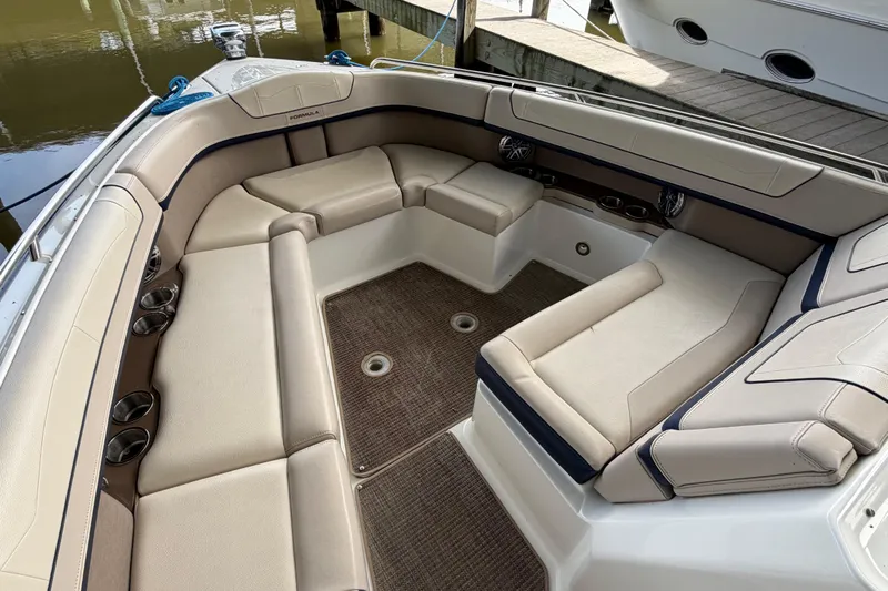  Yacht Photos Pics 2017 Formula 350 Crossover Bowrider interior with beige seating and cup holders.