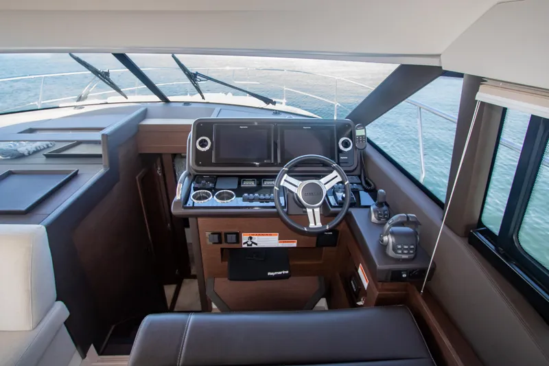 Fantasea Yacht Photos Pics Prestige 460 Fly 2020 yacht helm station with modern navigation equipment.