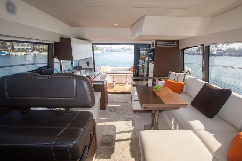 Fantasea Yacht Photos Pics Interior of 2020 Prestige 460 Fly yacht with modern seating and waterfront view.