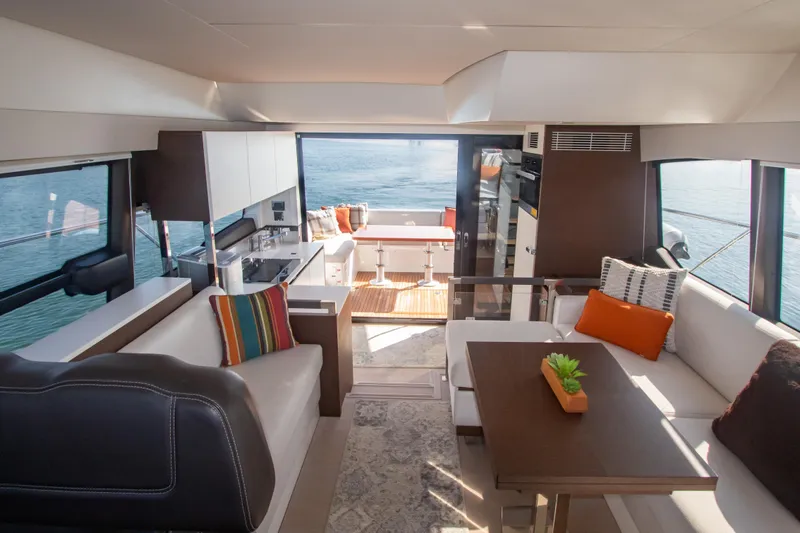 Fantasea Yacht Photos Pics Luxurious interior of 2020 Prestige 460 Fly yacht with modern furnishings and ocean view.