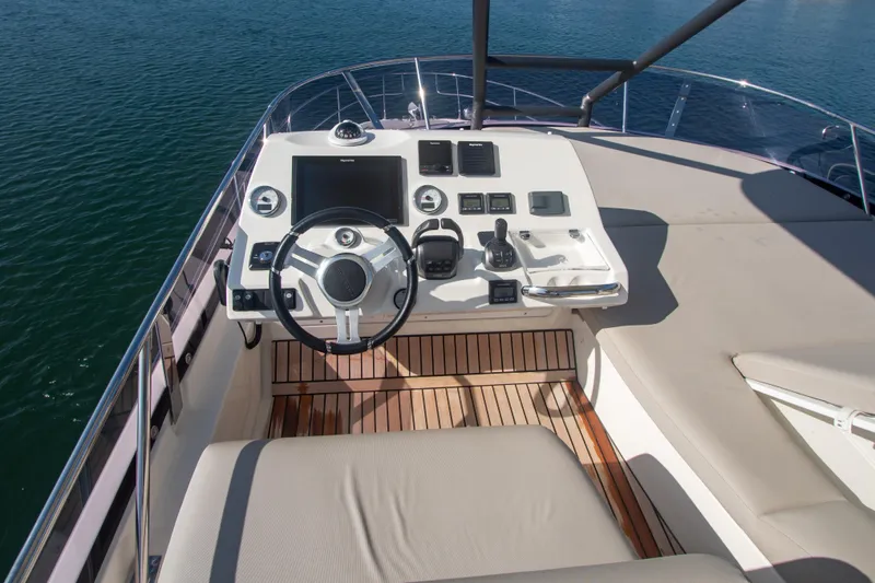 Fantasea Yacht Photos Pics Prestige 460 Fly 2020 yacht helm station with modern controls and comfortable seating.