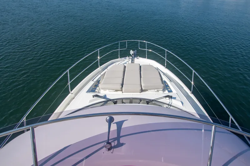 Fantasea Yacht Photos Pics Prestige 460 Fly 2020 yacht bow with sun loungers on calm water.