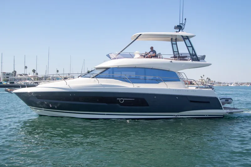 Fantasea Yacht Photos Pics 2020 Prestige 460 Fly yacht cruising in a marina.