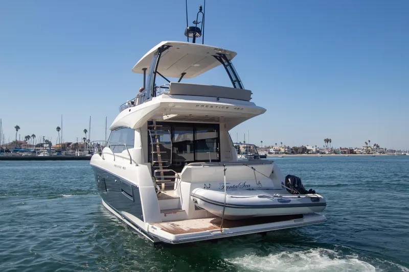 Fantasea Yacht Photos Pics 2020 Prestige 460 Fly yacht cruising in a marina.