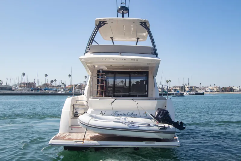 Fantasea Yacht Photos Pics 2020 Prestige 460 Fly yacht with dinghy, docked in a marina.