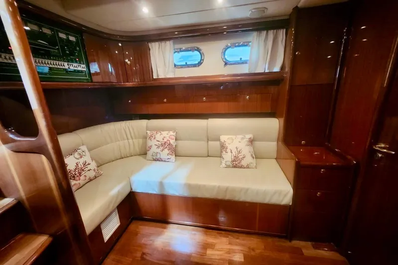  Yacht Photos Pics Luxurious interior of 1998 Cayman Yachts 40 W.A. with elegant wood finish and cozy seating.