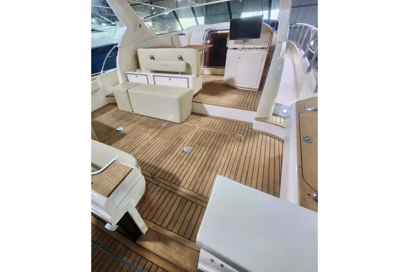  Yacht Photos Pics Luxurious 1998 Cayman Yachts 40 W.A. interior with elegant wooden flooring and seating.
