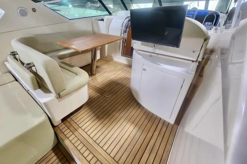  Yacht Photos Pics Luxurious interior of 1998 Cayman Yachts 40 W.A. with wood flooring and seating area.