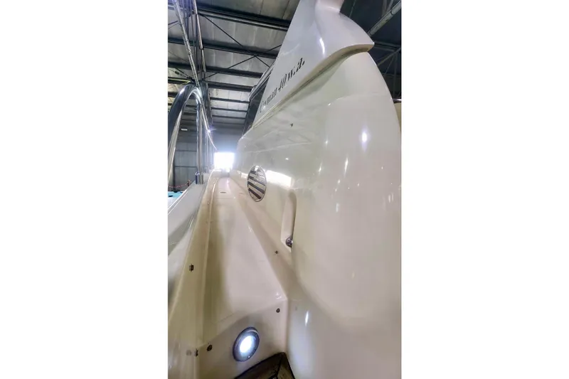  Yacht Photos Pics 1998 Cayman Yachts 40 W.A. in a warehouse, showcasing sleek white exterior design.