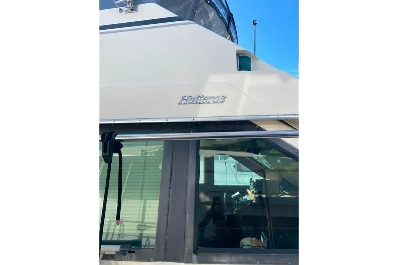  Yacht Photos Pics 1988 Hatteras 40 Double Cabin yacht exterior with logo and window detail.