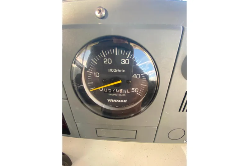  Yacht Photos Pics Yanmar engine tachometer on 1988 Hatteras 40 Double Cabin boat dashboard.