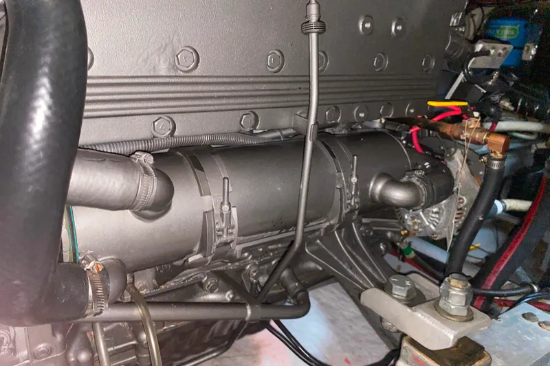  Yacht Photos Pics Engine compartment of 1988 Hatteras 40 Double Cabin boat, showcasing mechanical components.