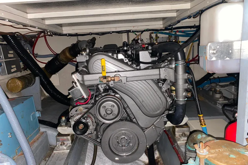  Yacht Photos Pics Engine room of 1988 Hatteras 40 Double Cabin yacht, showcasing mechanical components.