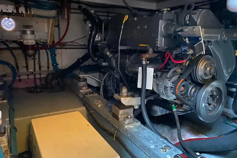  Yacht Photos Pics Engine room of 1988 Hatteras 40 Double Cabin yacht, showcasing mechanical components.