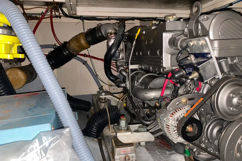  Yacht Photos Pics Engine room of a 1988 Hatteras 40 Double Cabin yacht, showcasing mechanical components.