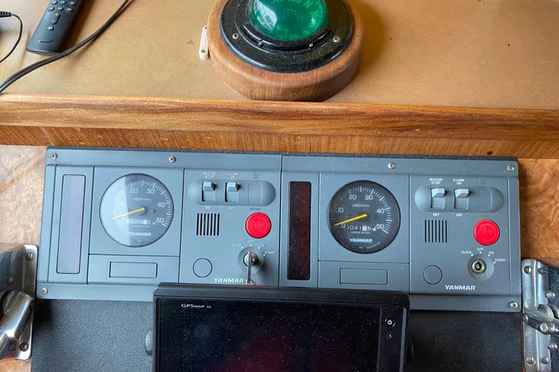  Yacht Photos Pics Control panel of a 1988 Hatteras 40 Double Cabin with Yanmar gauges and GPS device.