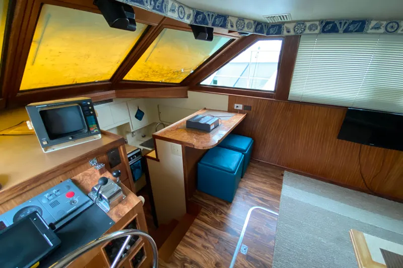  Yacht Photos Pics 1988 Hatteras 40 Double Cabin interior with helm, seating, and nautical decor.
