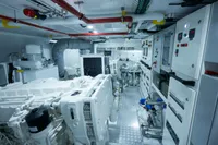 Engine room of a 2020 custom schooner, featuring advanced machinery and control panels.