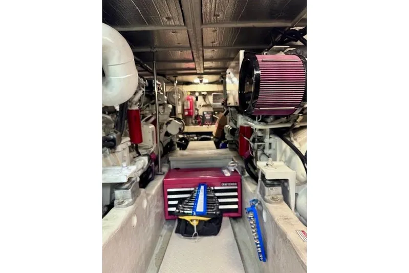 Hustler I Yacht Photos Pics Engine room of a 2000 Sea Ray 560 Sedan Bridge with tools and equipment.
