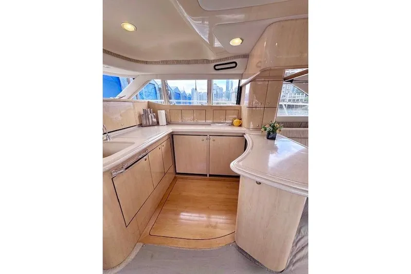 Hustler I Yacht Photos Pics Luxurious kitchen interior of 2000 Sea Ray 560 Sedan Bridge yacht.