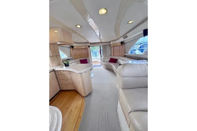 Hustler I Yacht Photos Pics Luxurious interior of a 2000 Sea Ray 560 Sedan Bridge yacht with elegant furnishings.