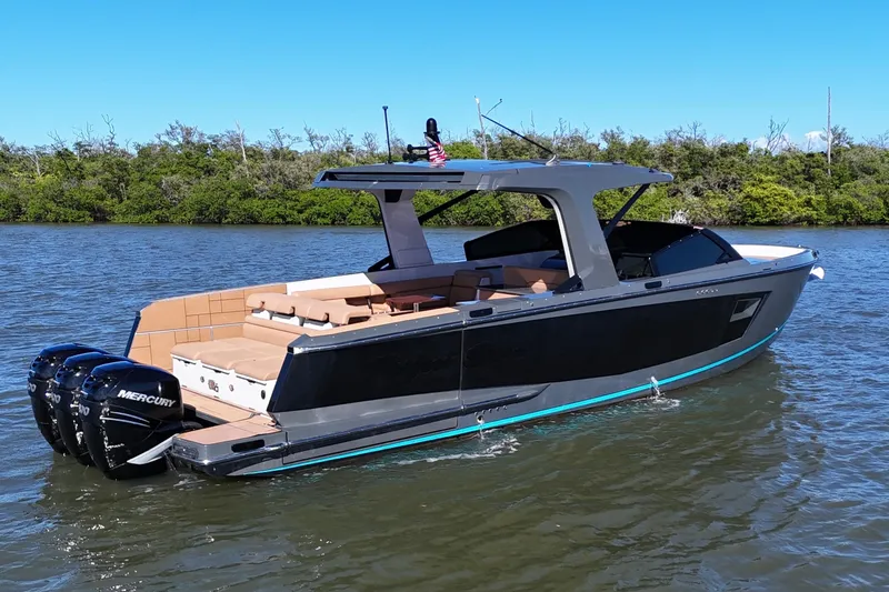  Yacht Photos Pics 2022 Aviara AV40 OB luxury boat with triple Mercury outboard engines on a calm river.