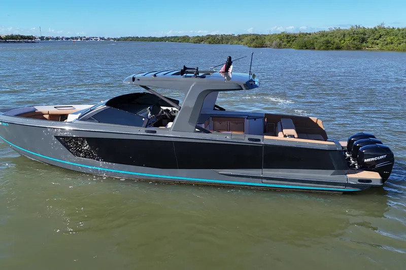  Yacht Photos Pics 2022 Aviara AV40 OB luxury boat cruising on a calm river.