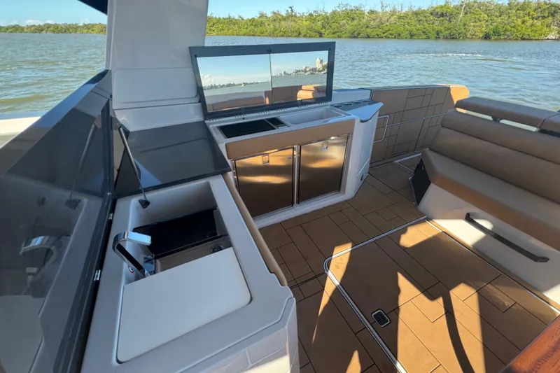  Yacht Photos Pics Luxury interior of 2022 Aviara AV40 OB boat with modern amenities and scenic water view.