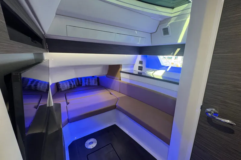  Yacht Photos Pics Luxurious interior cabin of 2022 Aviara AV40 OB boat with modern seating and ambient lighting.