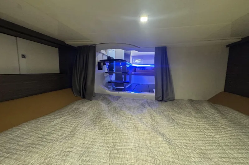  Yacht Photos Pics Interior cabin of 2022 Aviara AV40 OB boat with modern lighting and cozy bedding.